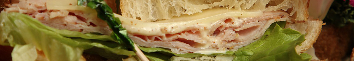 Eating Sandwich Vegan Bakery at Fiore's Bakery restaurant in Jamaica Plain, MA.